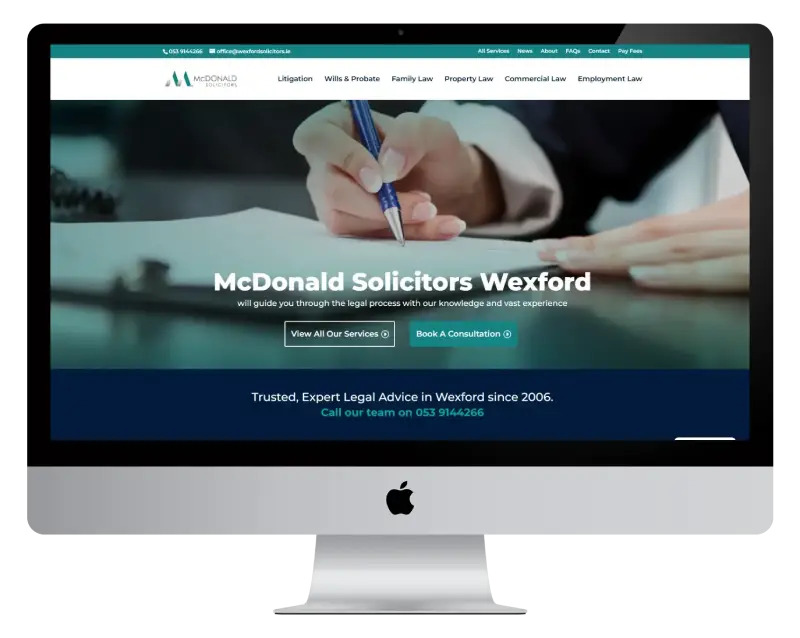 wexford-solicitors-desktop Predictions 2025 How the Web Will Change Text Over Image of Hands Holding Tablet and Gadgets with MEANit logo.